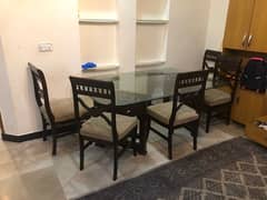 a beautiful chinoti dinning table with 6 chairs for sale