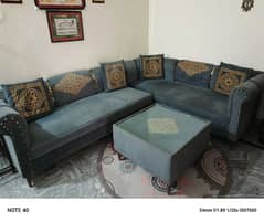 L shape sofa with center table
