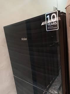 Haier e star glass door new condition model no . 3.0. 6. urgent sale