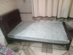 Single wooden bed with medicated mattress