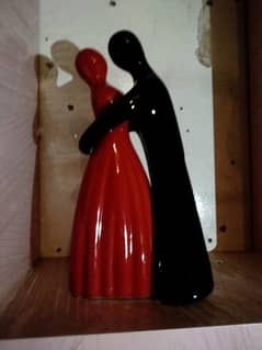 Red and black ceramic couple