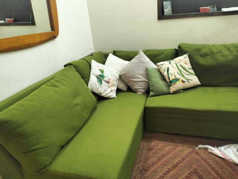 l shaped green sofa 1