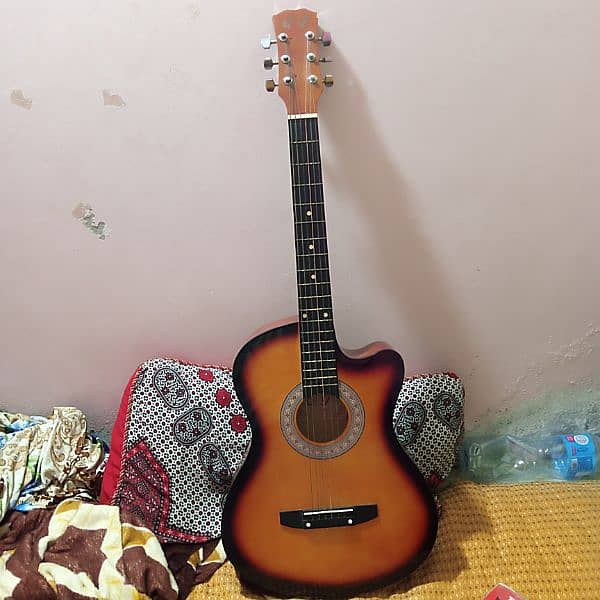 acoustic guitar with 1 siting pack  and 2 playing nobe 0