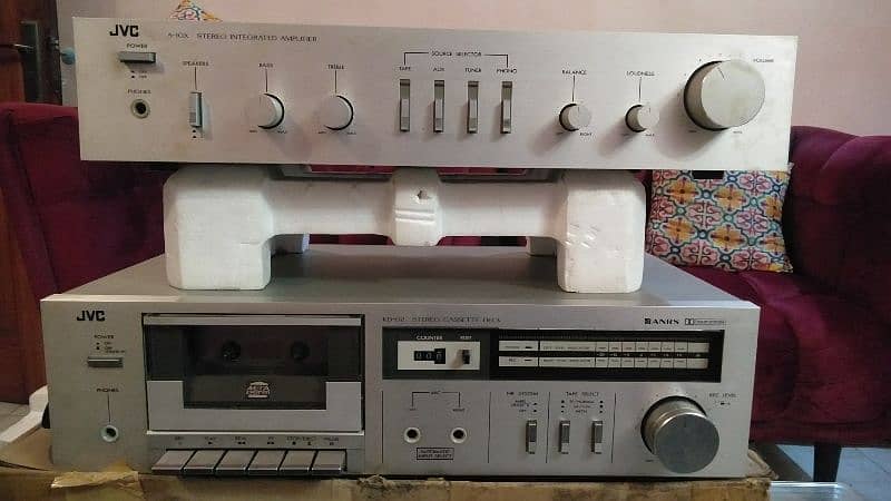 a beautiful old antique tape recorder and Amplifer 10