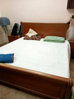 kind size bed with two side tables and mattress