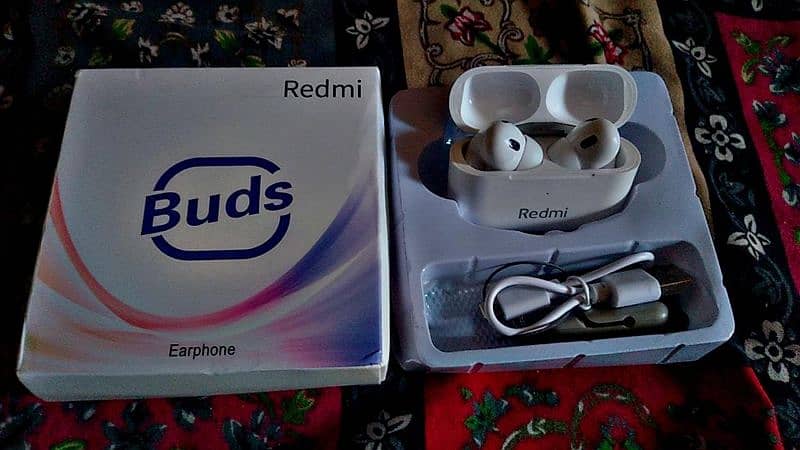 original and new earbuds of Redmi company 0