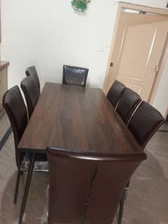 dining table with 8 chairs in new condition.