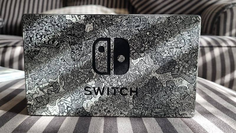 Nintendo Switch with Dbrand skin + 2 games + GC Controllers 5