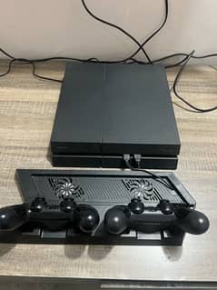 PS4 with 2 Controllers & Games