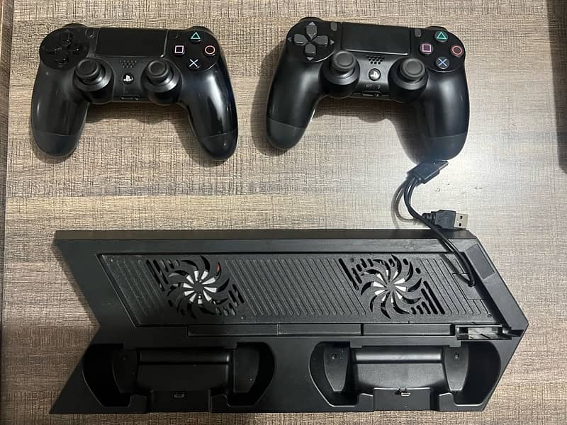 PS4 with 2 Controllers & Games 3
