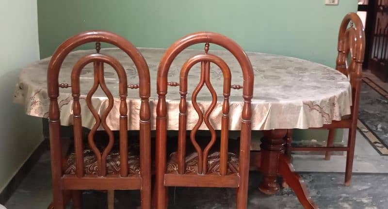 we Selling a Pure wood dining table With 6 chairs for family 4