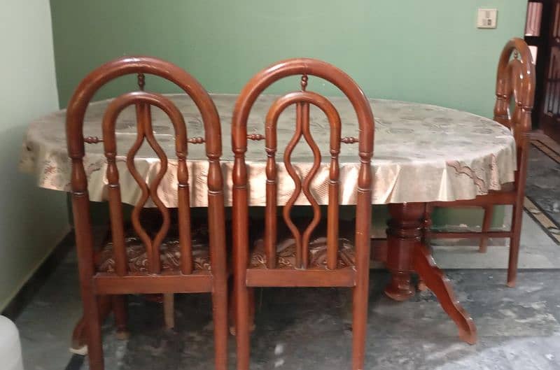 we Selling a Pure wood dining table With 6 chairs for family 5