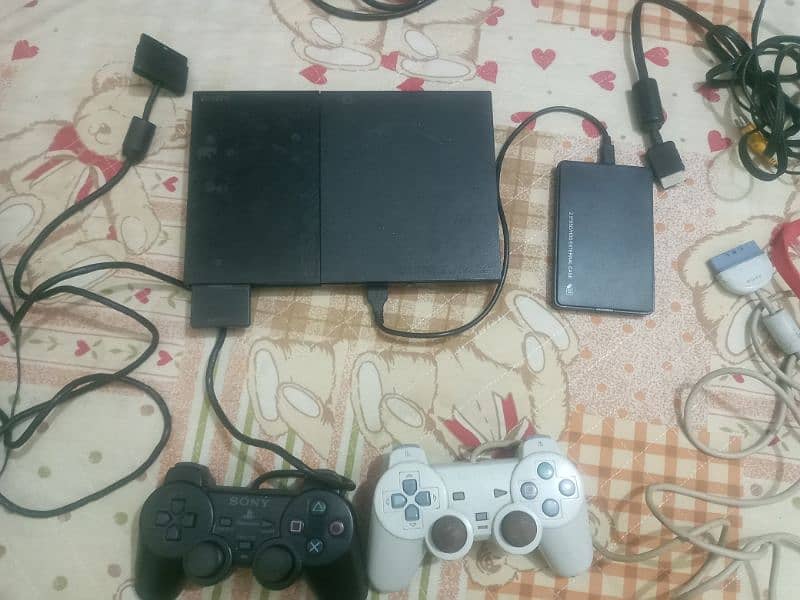 Playstation 2 converted into Ps 3 With 2 G- shocks  in mint contion 8