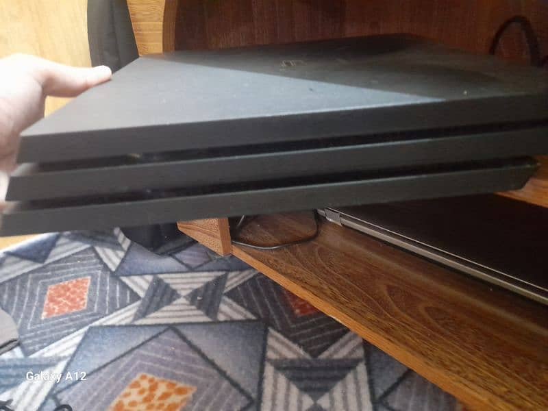 PS4 pro with two high-quality remotes and 5 video games 7