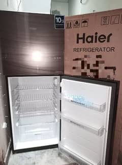 New Haire Glass door refrigerator only 3 moth used with warranty