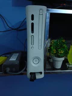 Xbox 360 with a controller and pre installed games
