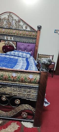 iron bed set and two chairs