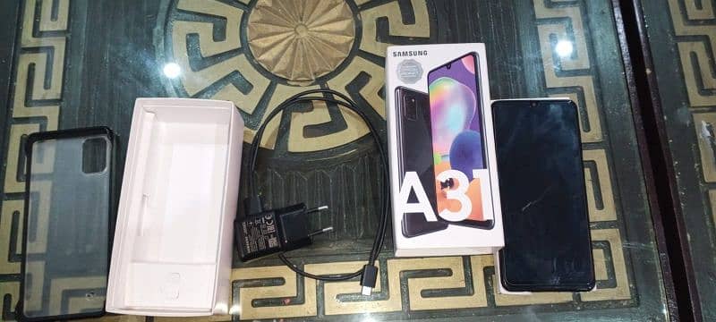 Samsung A31 reasonable price , with box charger 9