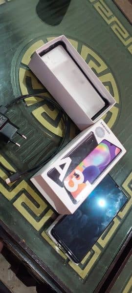 Samsung A31 reasonable price , with box charger 11