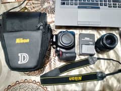Nikon D5200 with lens with extra battery