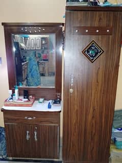 wardrobe and bed without mattress