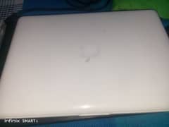 MacBook mid white best condition | selling due to emergency