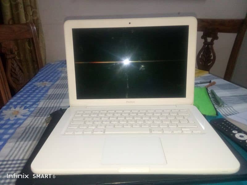 MacBook mid white best condition | selling due to emergency 1