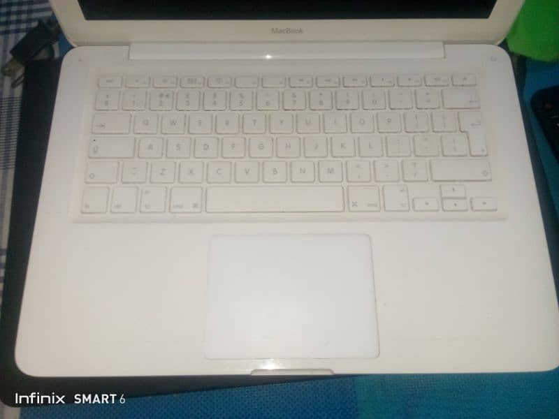 MacBook mid white best condition | selling due to emergency 2