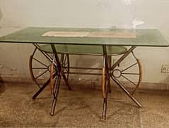 Dinning glass table with solid 5 wooden chairs.