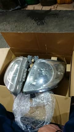 suzuki swift 2011 model headlights pair. in good condition 0