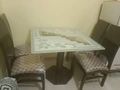 Selling Wooden Dining Table with Glass top and 4 chairs . . . conditio