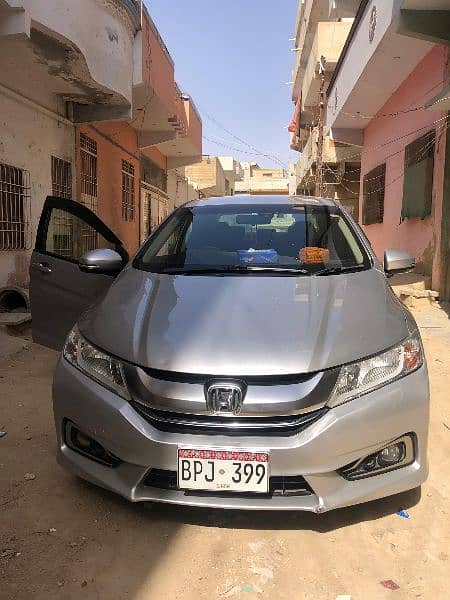 I am selling my car Honda Grace hybrid 2015 registration 2019 in Sindh 2