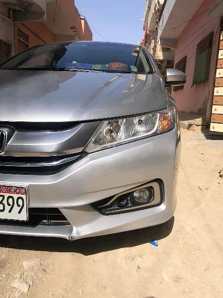 I am selling my car Honda Grace hybrid 2015 registration 2019 in Sindh 3