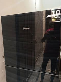 new condition Haier E ster glass dor 10 by 10 . Urgent sale