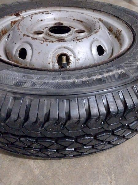 unused Alto tyre with rim - stapny 0
