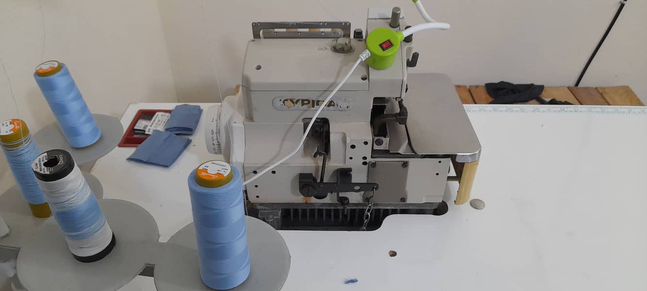 2 singer 1 flat 1 overlock for sale. Rs160000 price. Working and condi 2