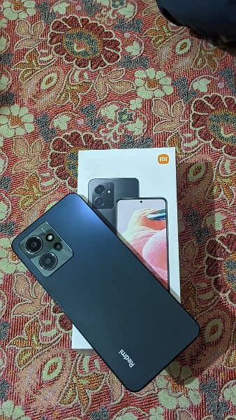 redmi note 12 phone with genuine charger and box 1