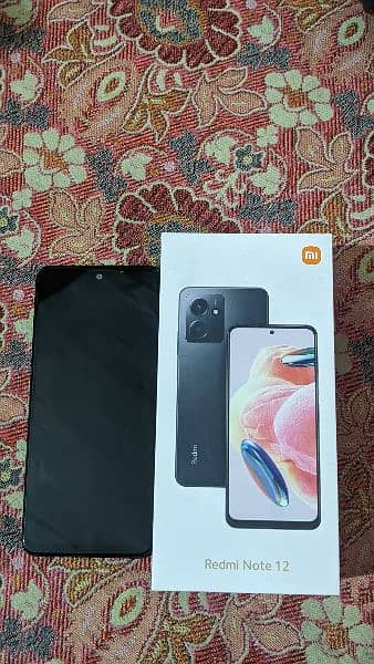 redmi note 12 phone with genuine charger and box 2
