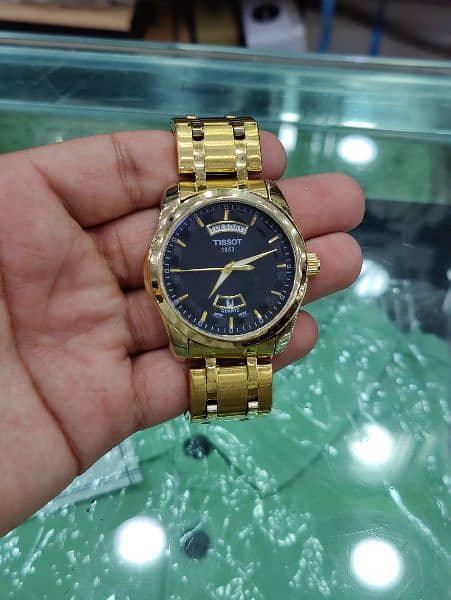 TISSOT Day AND Date Watch in Golden Colour Contact on:03143499600 3