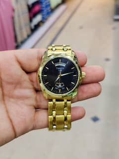 TISSOT Day AND Date Watch in Golden Colour Contact on:03143499600 0