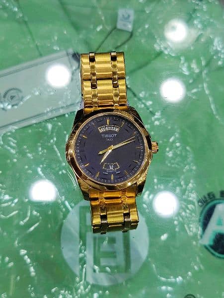TISSOT Day AND Date Watch in Golden Colour Contact on:03143499600 4