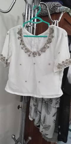 white saree with silver dhabka and nug work