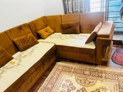 brown and beige L shaped corner sofa