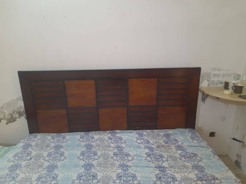 wooden bed with mattress 0