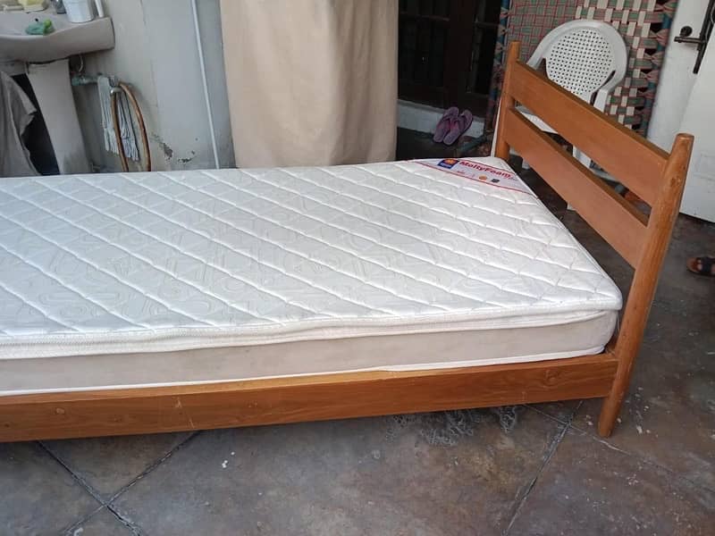 wooden single bed with side table and mattress 2