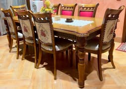 8 Teak wood chairs (no table)