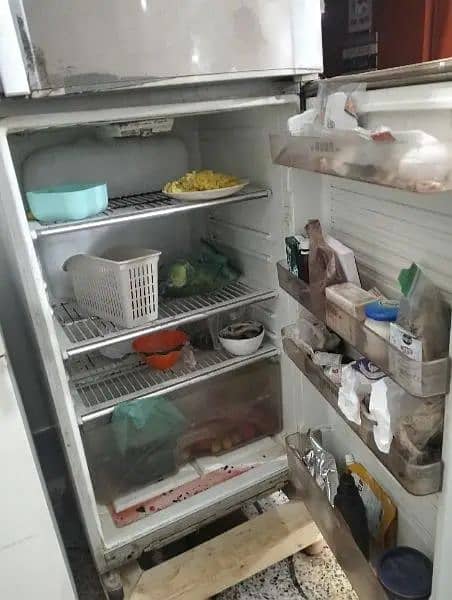 refrigerator in use condition. 8/10 condition 1