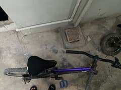 metal frame , raped in purple, gray, black and carbon fiber