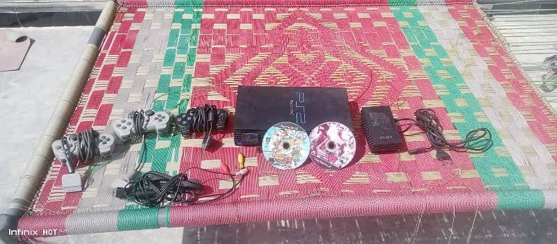 playstation 2 with 3 controller 4