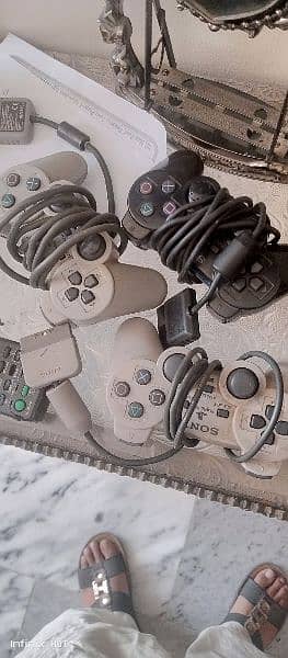 playstation 2 with 3 controller 5